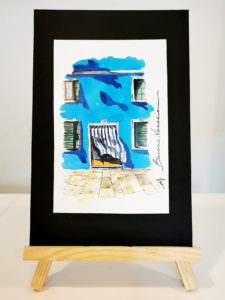 Burano blue house with curtain