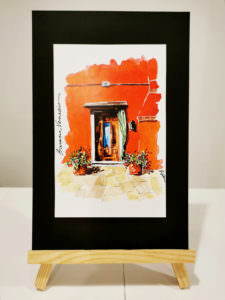 Burano red house with door and flowers